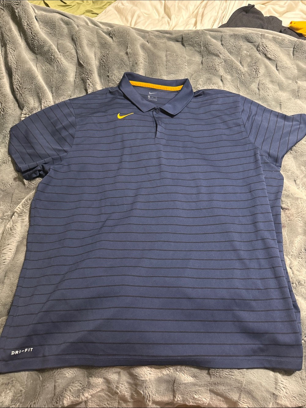 Nike Men's Blue Striped Polo with Yellow Swoosh